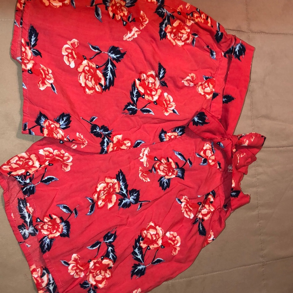 Cherry red floral printed Justice shorts.